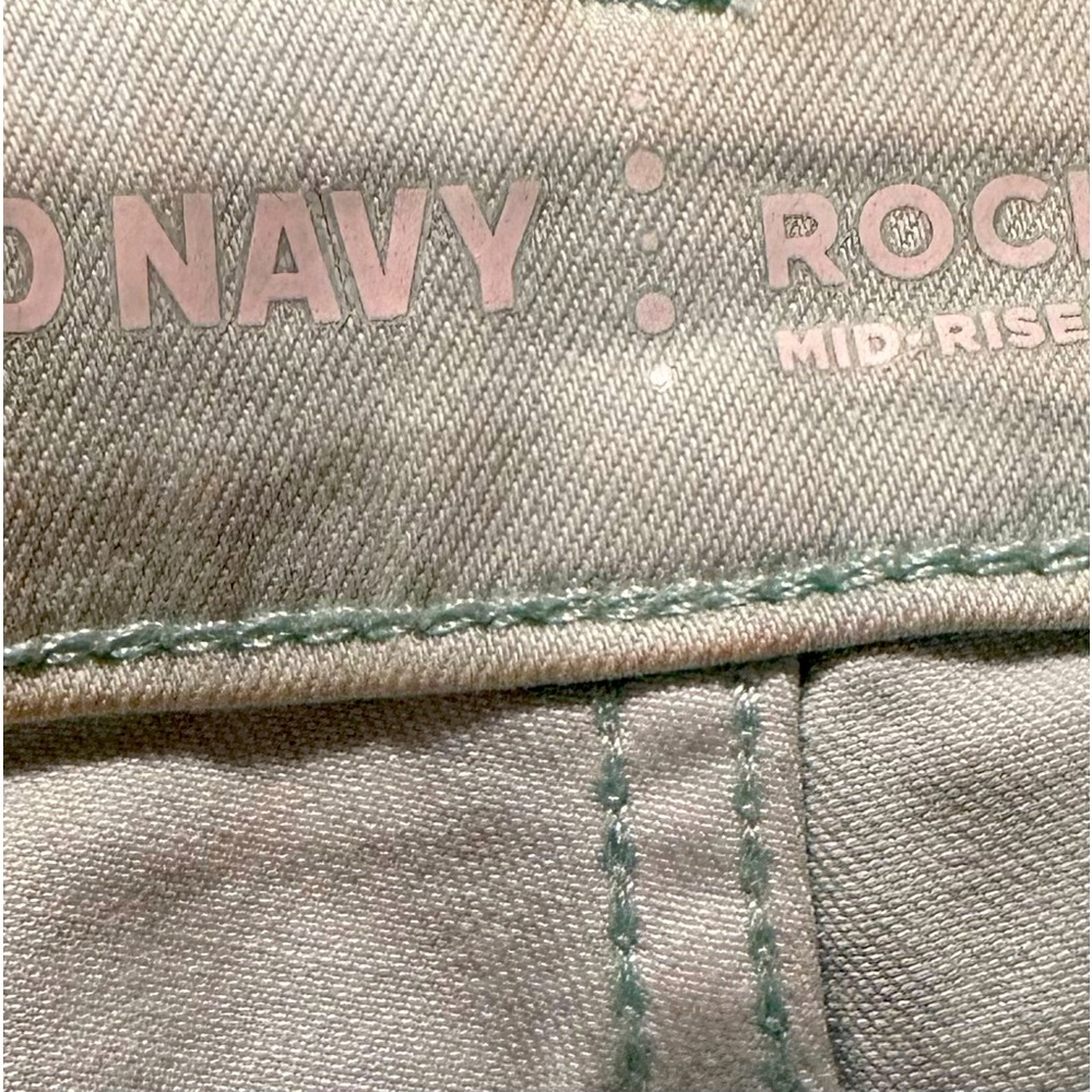 Old Navy, mid rise jeans. Mint color with holes pre made into the jeans